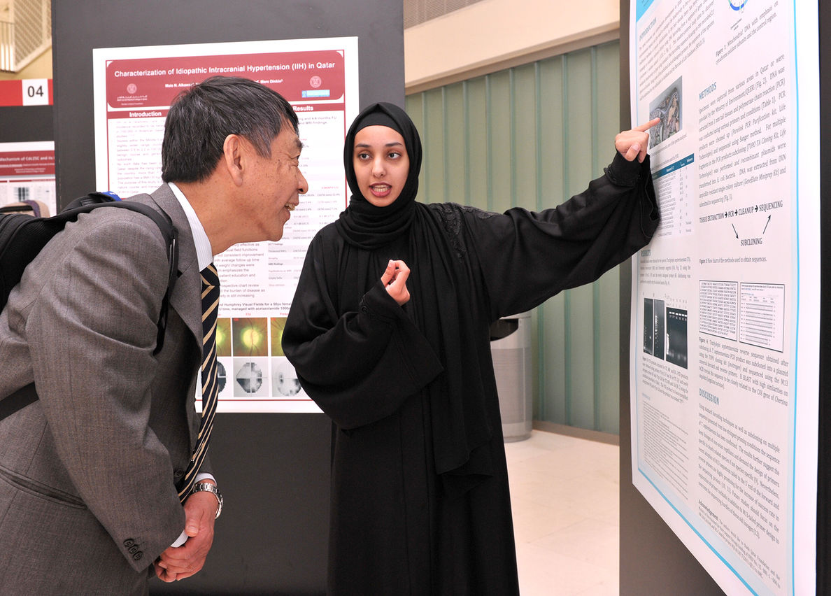 2 - Student Dhabiya Al-kubaisi presenting her poster.jpg
