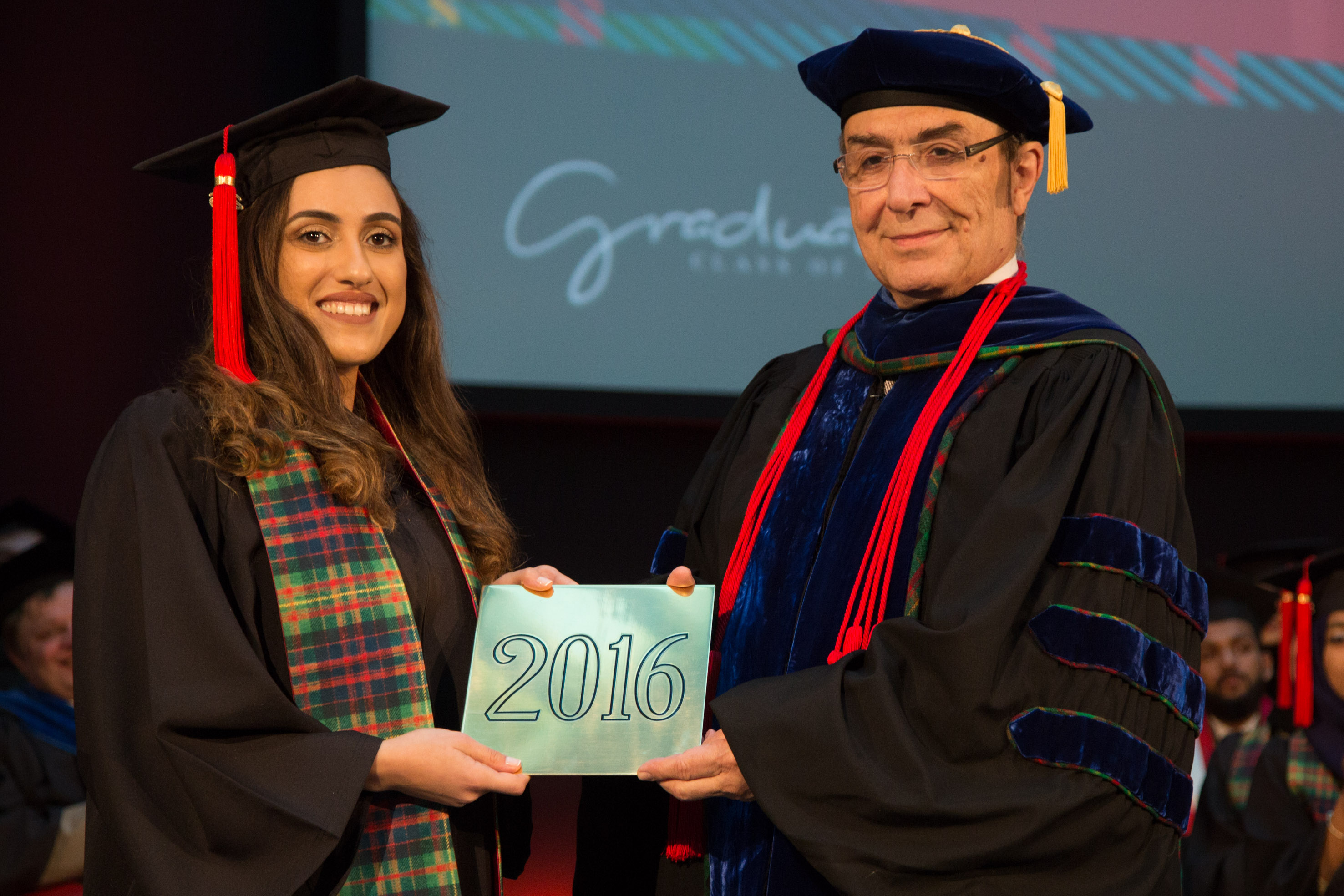Dean and CEO of CMU-Q Ilker Baybars and Student Speaker Nada Arakji.jpg