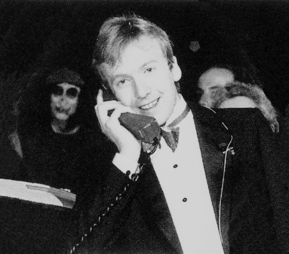 Michael_Harrison_making_the_UK's_first_mobile_call_using_a_Vodafone_VT1_Transportable_phone,_1st_January_1985.jpg