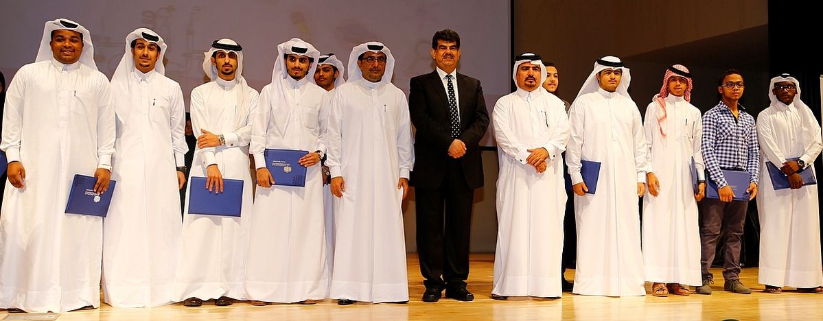 QNRF officials with some of the winners from the third cycle of the Secondary School Research Experience Program.jpg
