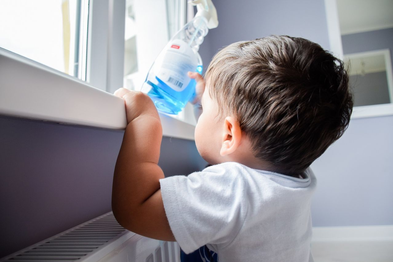 Shutterstock - Child with cleaning product.jpg