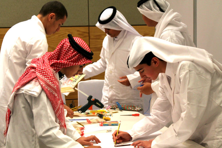 Students designing their bridges during the Science Challenge.JPG